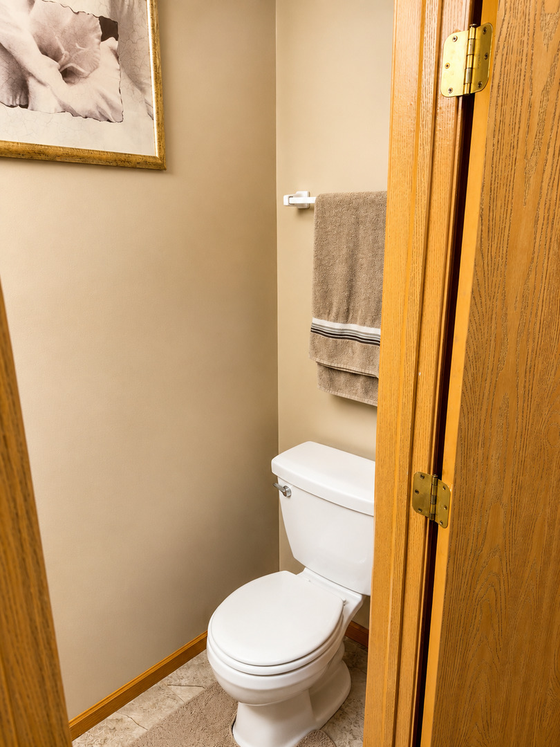 720 Ridge Drive Marengo, IL 60152 - Photo 14 of 34 a white toilet sitting next to a small sink