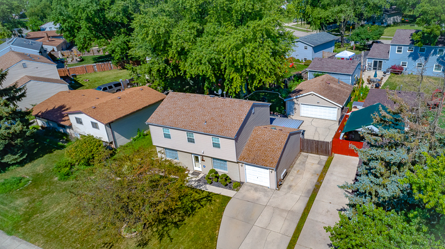 558 Redwood Road Bolingbrook, IL 60440 - Photo 2 of 12 an aerial view of a house with a garden