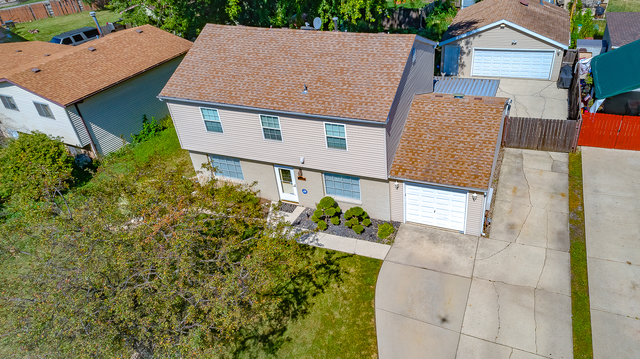 558 Redwood Road Bolingbrook, IL 60440 - Photo 12 of 12 an aerial view of a house with a yard and fountain