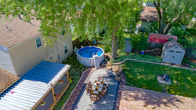 558 Redwood Road Bolingbrook, IL 60440 - Photo 4 of 12 a view of a chairs and table in the garden