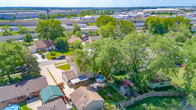 558 Redwood Road Bolingbrook, IL 60440 - Photo 7 of 12 an aerial view of a house with a yard basket ball court and outdoor seating