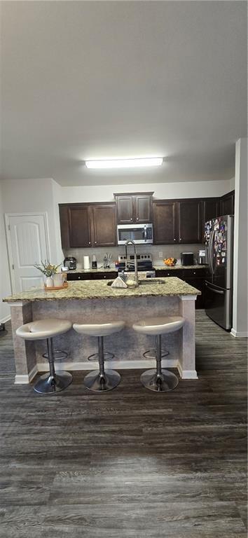 4757 Rdg Vly Drive Gainesville, GA 30504 - Photo 11 of 35 a kitchen with kitchen island granite countertop a sink and counter space