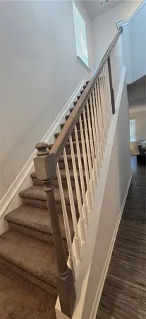 a bedroom with a bed and dresser