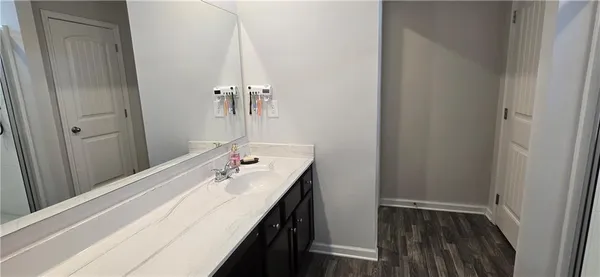 a bathroom with a glass shower door