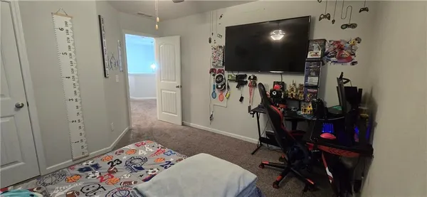 a bedroom with bed and window