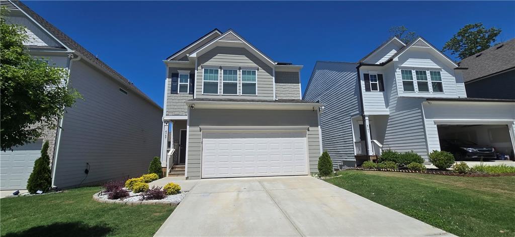 4757 Rdg Vly Drive Gainesville, GA 30504 - Photo 2 of 35 a front view of a house with a garden and plants