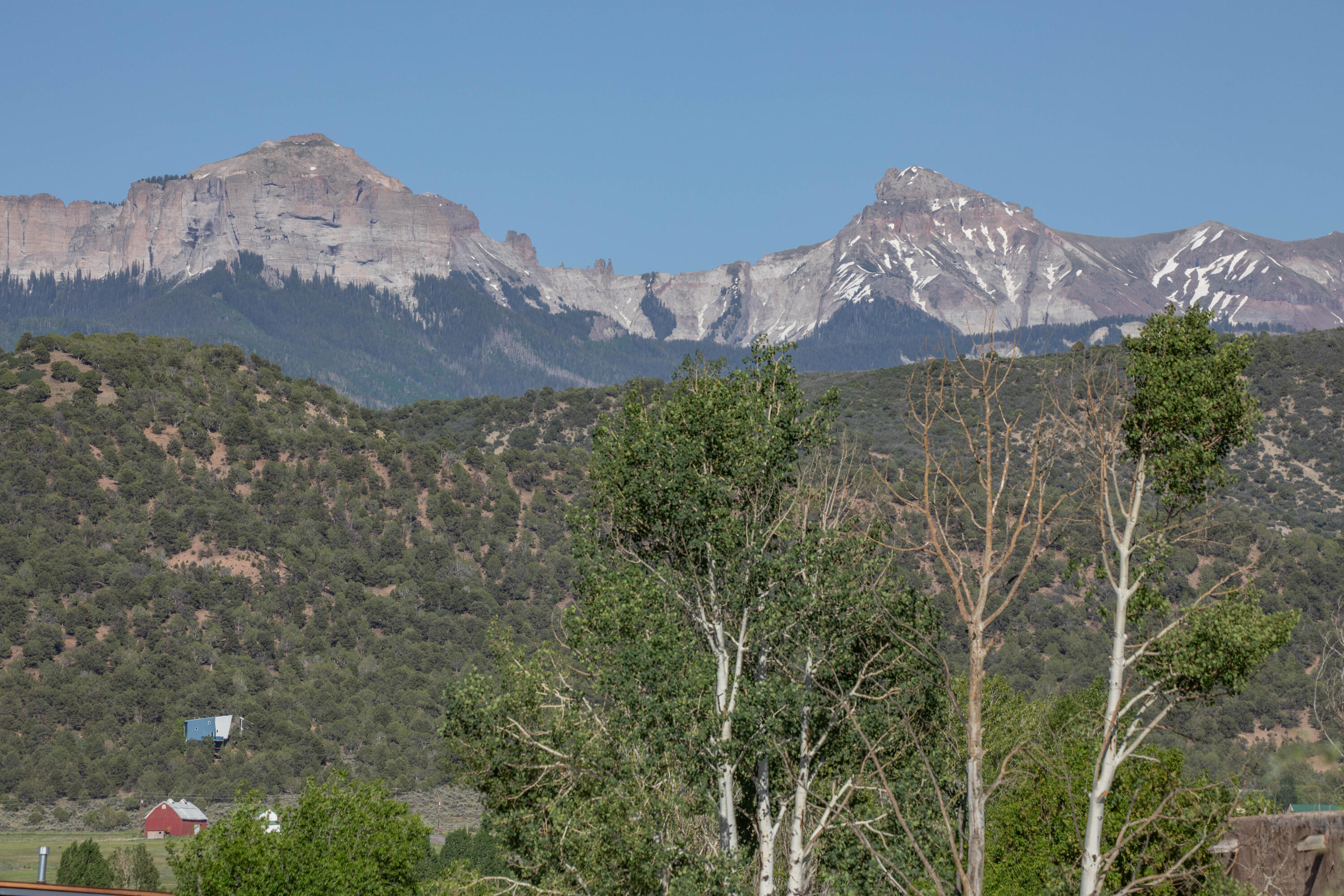 Tbd Hyde Street Ridgway, CO 81432 - Photo 18 of 19 a view of a house with a mountain and a forest