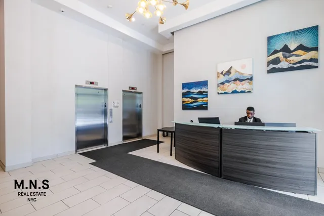 a kitchen with a refrigerator and a sink