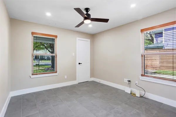 a view of an empty room with a window