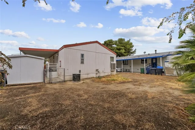 a view of a house with a yard and garage