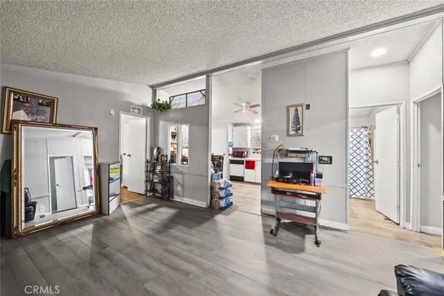 a kitchen with a white stove top oven and refrigerator