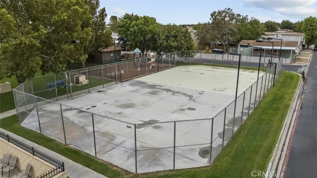 a front view of a house with a yard table and chairs