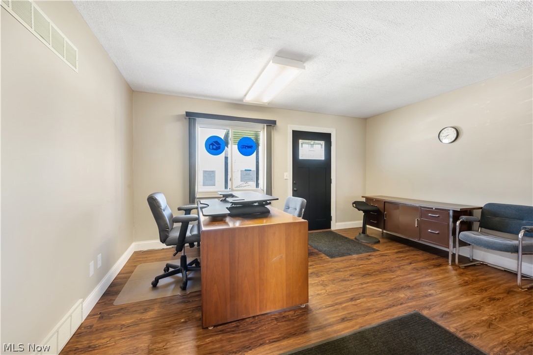 4001 South Cleveland Massillon Road Barberton, OH 44203 - Photo 5 of 25 Office space with dark wood-style flooring and a textured ceiling