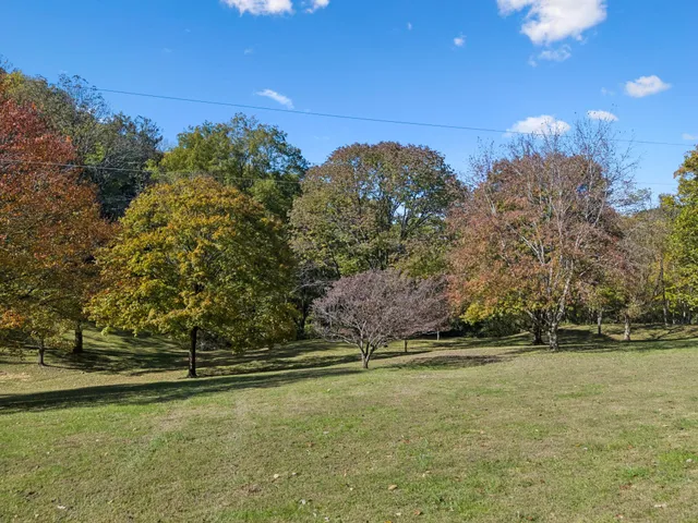 a view of a house with a big yard