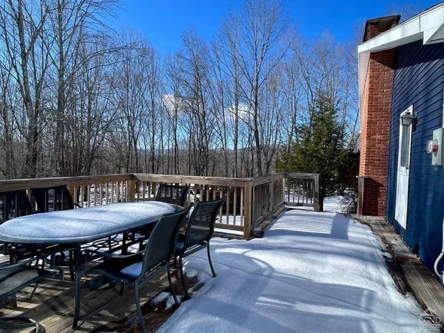 a view of a dinning table and chairs in the patio