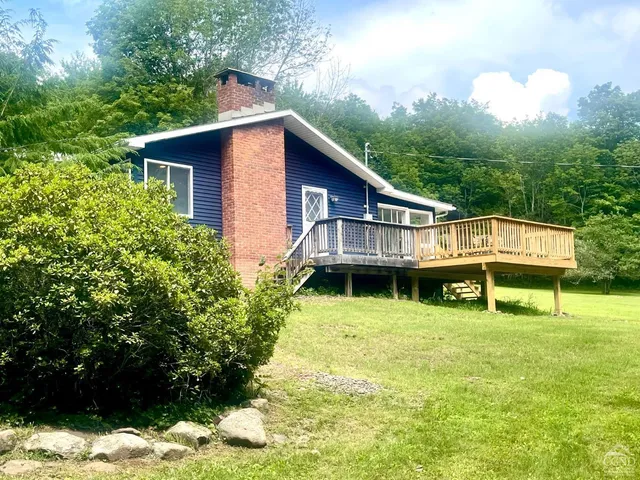 a house with trees in the background