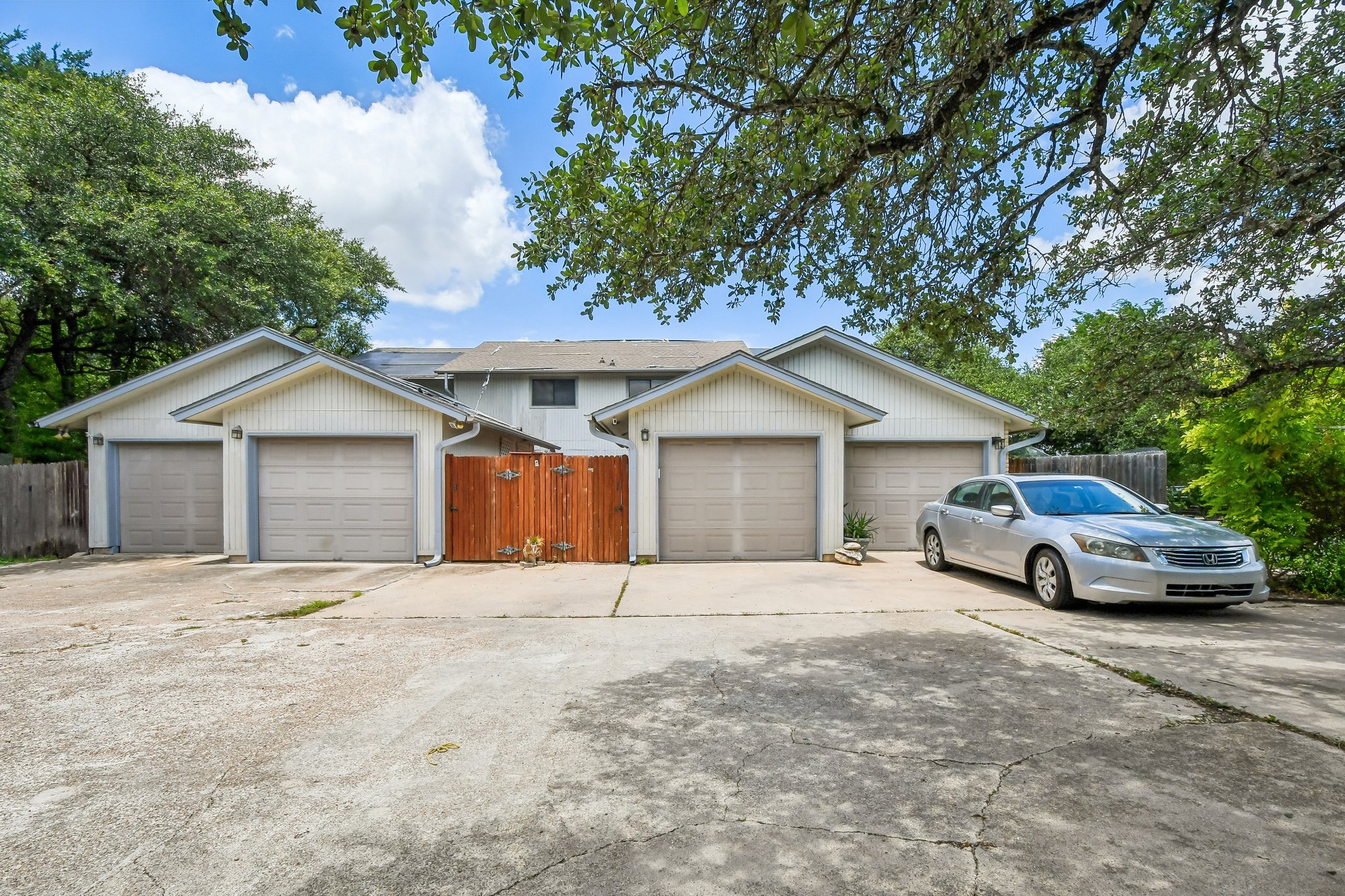 4202 Hudson Bend Road, Unit B Austin, TX 78734 - Photo 26 of 26 a front view of a house with a yard and garage