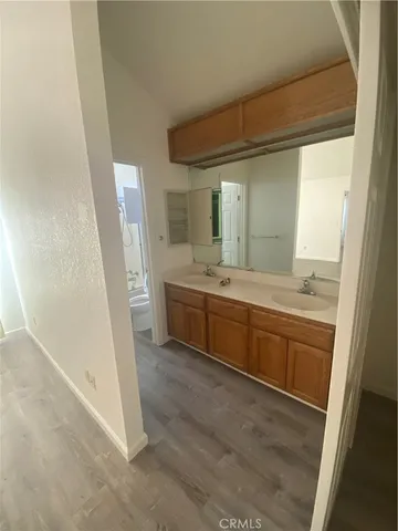 an empty room with wooden floor