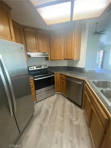 a view of a living room with wooden floor