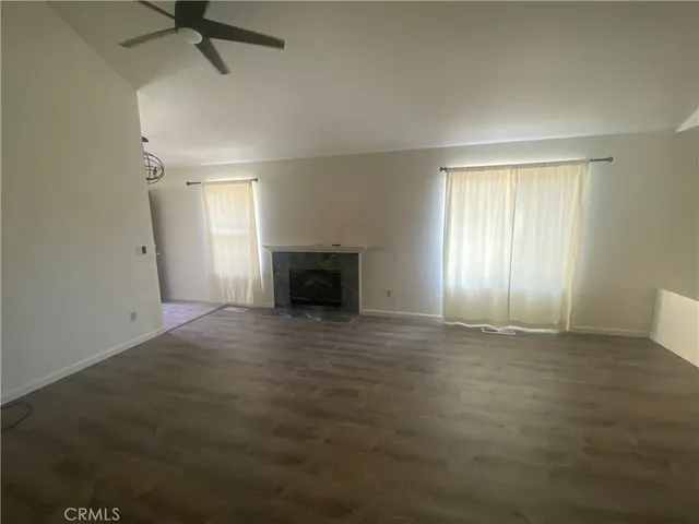 a kitchen with a refrigerator sink and cabinets