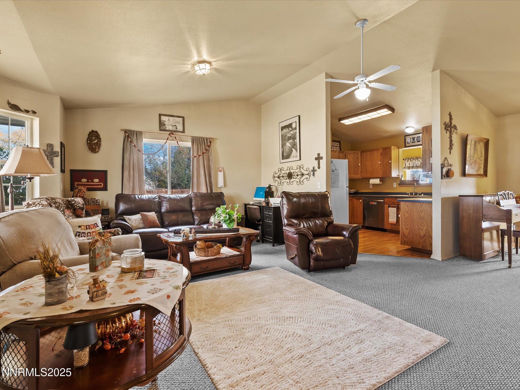 215 Hunter Park Way Fallon, NV 89406 - Photo 11 of 57 a living room with furniture and a chandelier