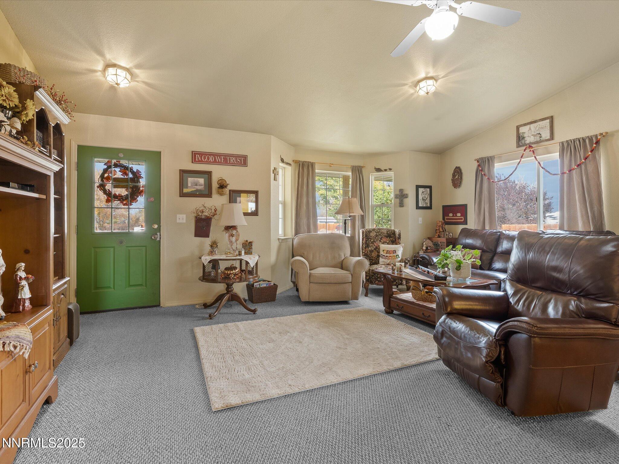 215 Hunter Park Way Fallon, NV 89406 - Photo 12 of 57 a living room with furniture and a flat screen tv