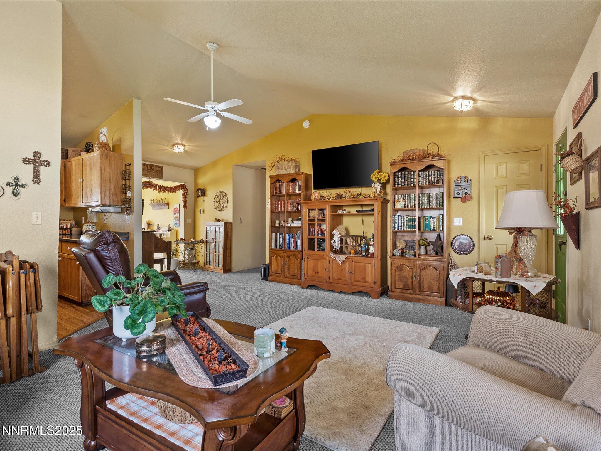 215 Hunter Park Way Fallon, NV 89406 - Photo 13 of 57 a living room with furniture and a flat screen tv