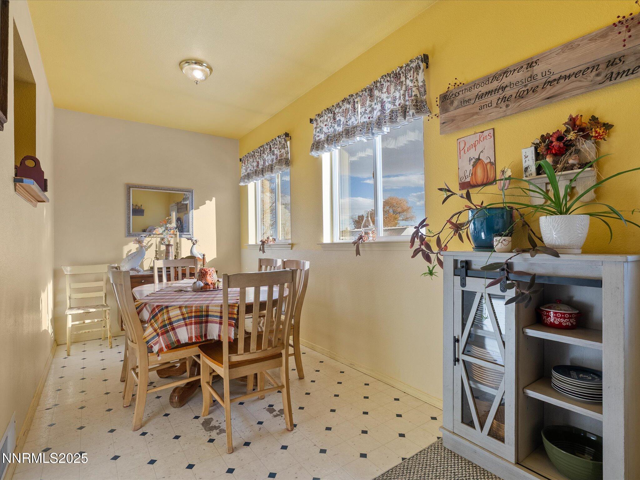 215 Hunter Park Way Fallon, NV 89406 - Photo 18 of 57 a view of a dining room with furniture and chandelier