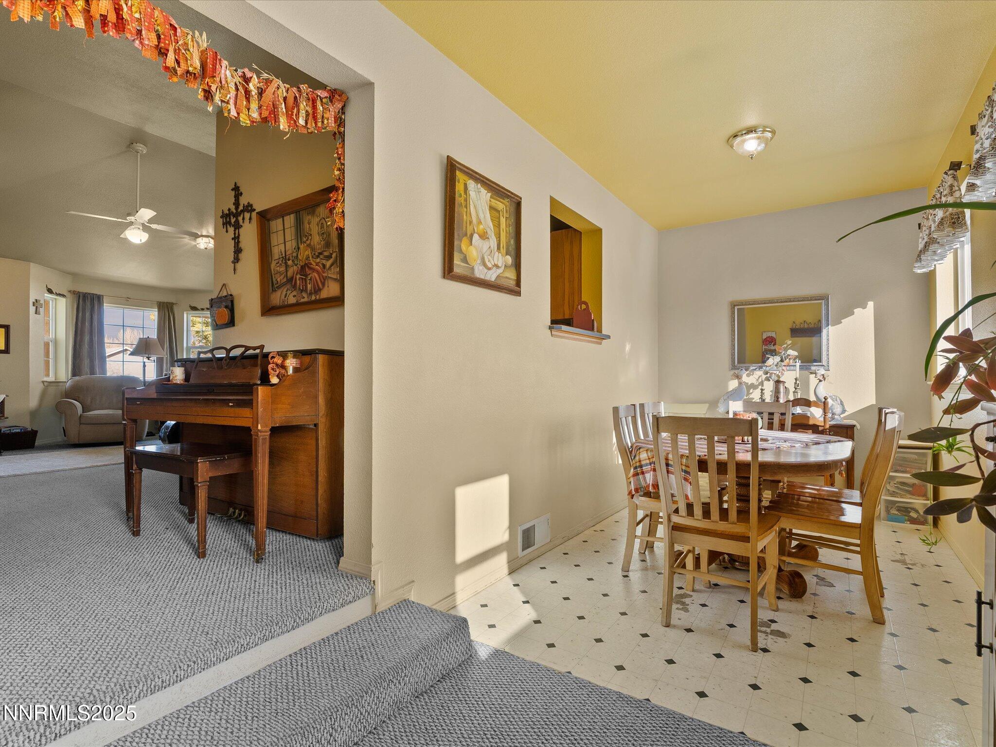 215 Hunter Park Way Fallon, NV 89406 - Photo 19 of 57 a view of a dining room and livingroom with furniture