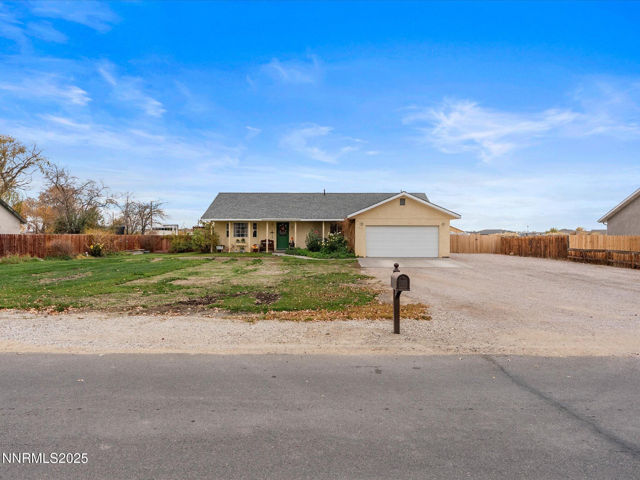 215 Hunter Park Way Fallon, NV 89406 - Photo 2 of 57 a house view with a garden space