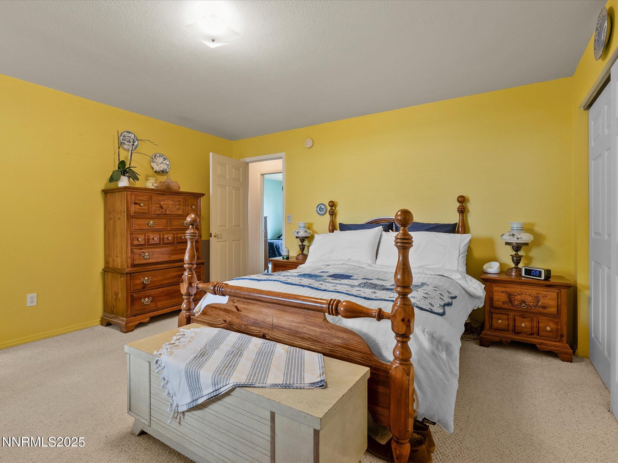 215 Hunter Park Way Fallon, NV 89406 - Photo 23 of 57 a bedroom with a bed and furniture