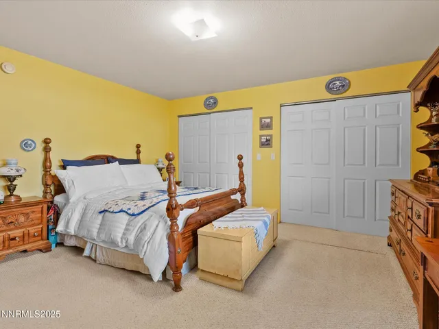 a bathroom with a sink a toilet and a shower curtain