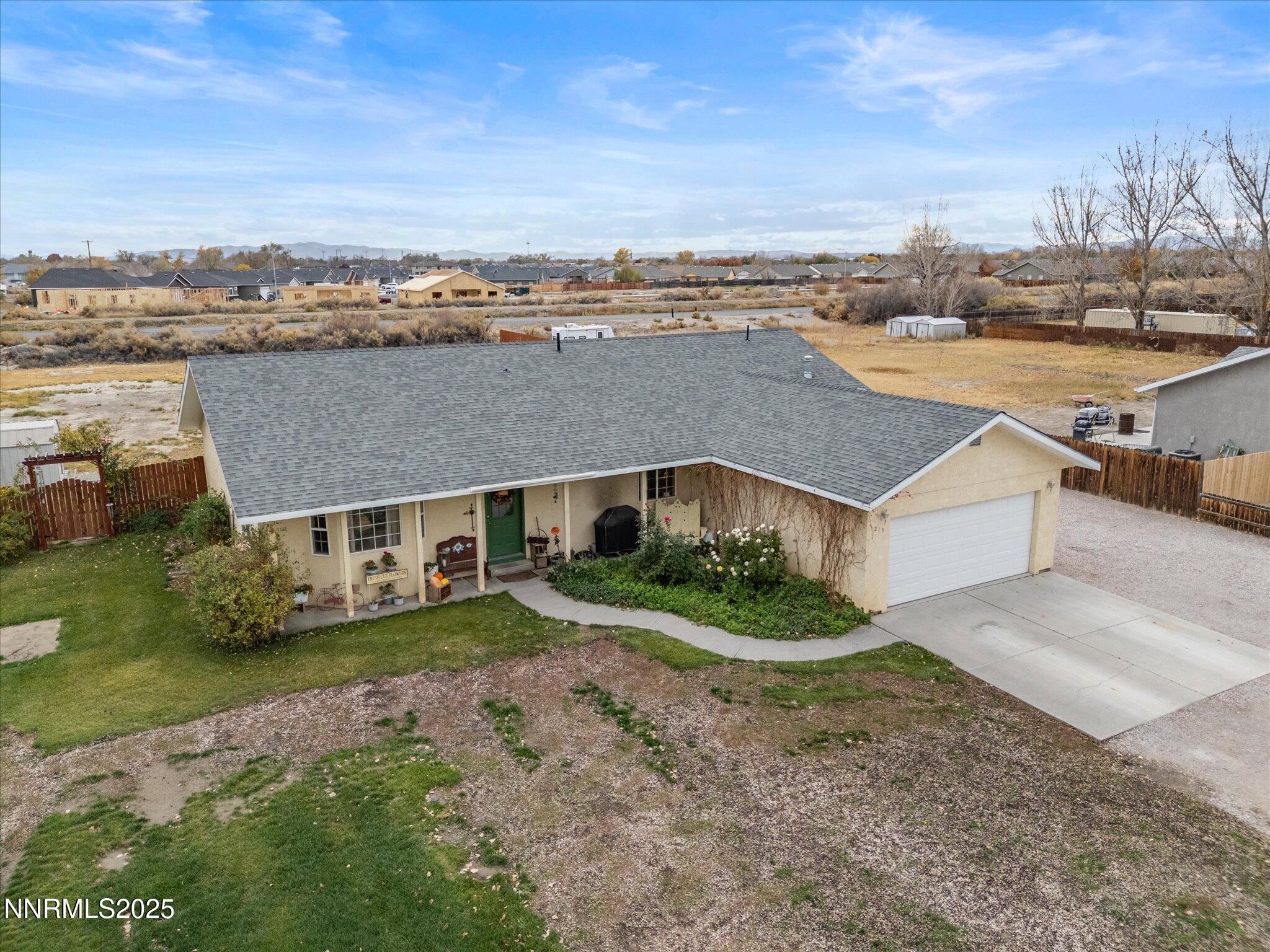 215 Hunter Park Way Fallon, NV 89406 - Photo 40 of 57 an aerial view of a house with a yard and lake view