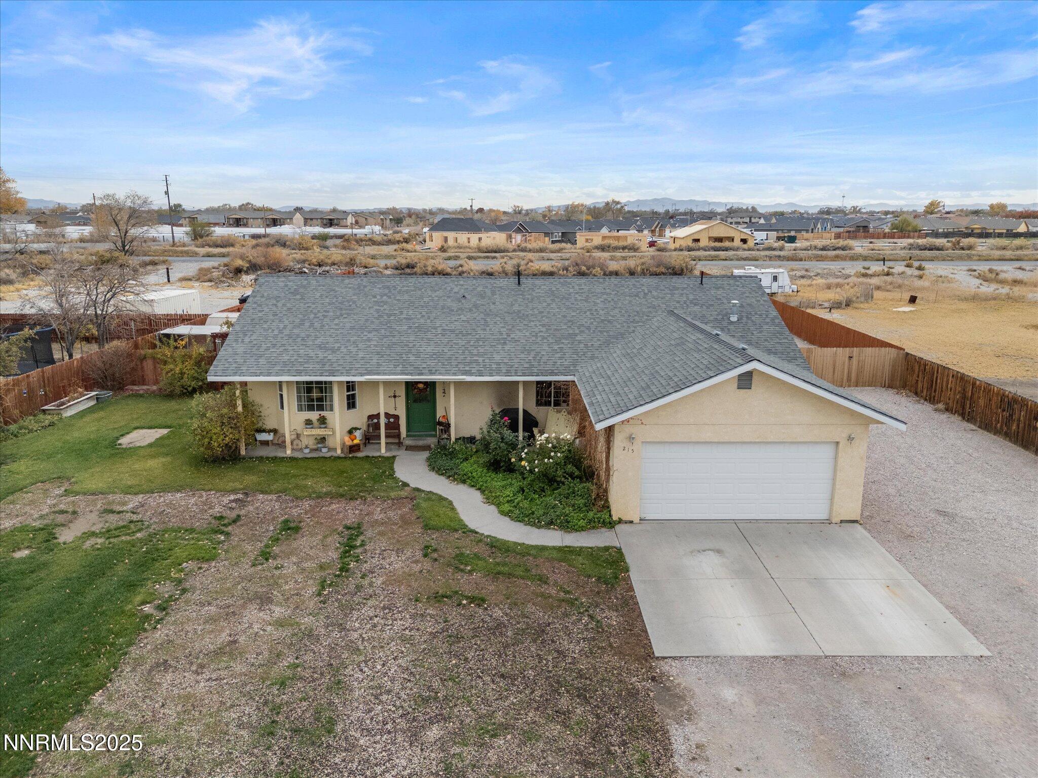 215 Hunter Park Way Fallon, NV 89406 - Photo 41 of 57 an aerial view of a house with a yard and ocean view