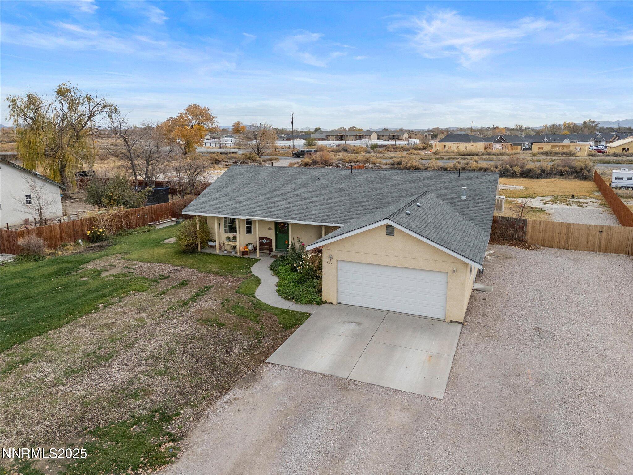 215 Hunter Park Way Fallon, NV 89406 - Photo 42 of 57 an aerial view of a house with a garden and trees
