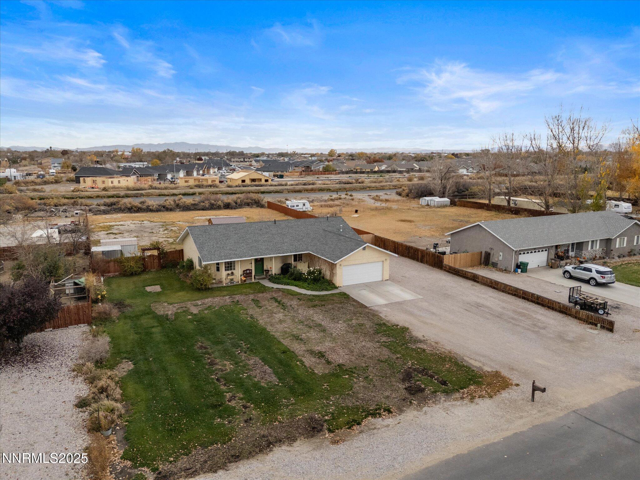215 Hunter Park Way Fallon, NV 89406 - Photo 45 of 57 an aerial view of a house with a garden and lake view