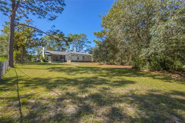 a view of a swimming pool with an outdoor space and seating area