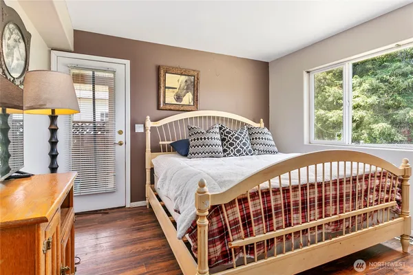 a bedroom with windows