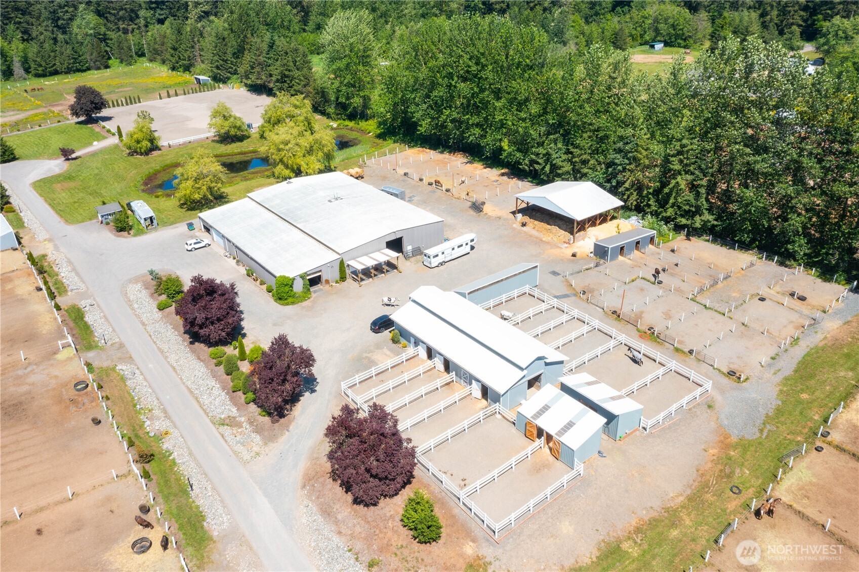 2176 Burk Road Blaine, WA 98230 - Photo 3 of 40 an aerial view of a house with a garden and mountain view in back
