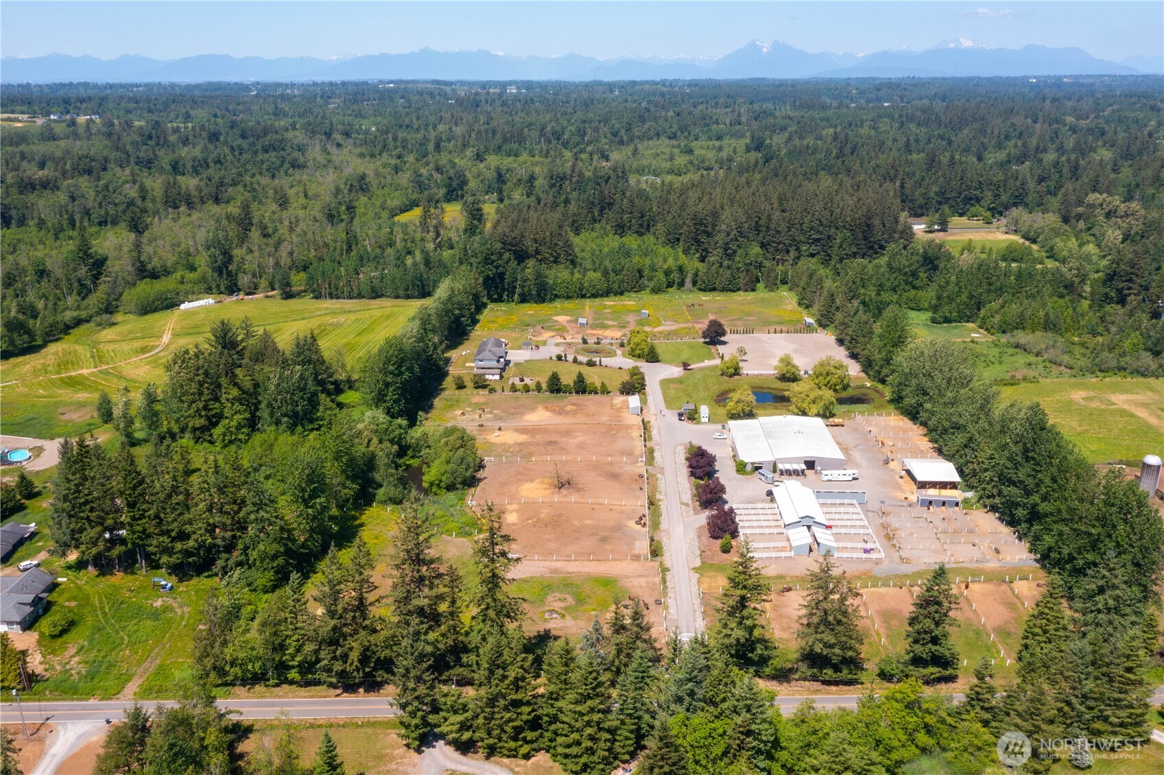 2176 Burk Road Blaine, WA 98230 - Photo 40 of 40 an aerial view of residential houses with outdoor space and trees