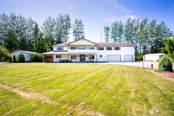a front view of a house with a swimming pool