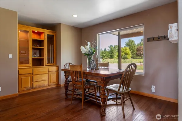 a view of a dining room with furniture window and wooden floor