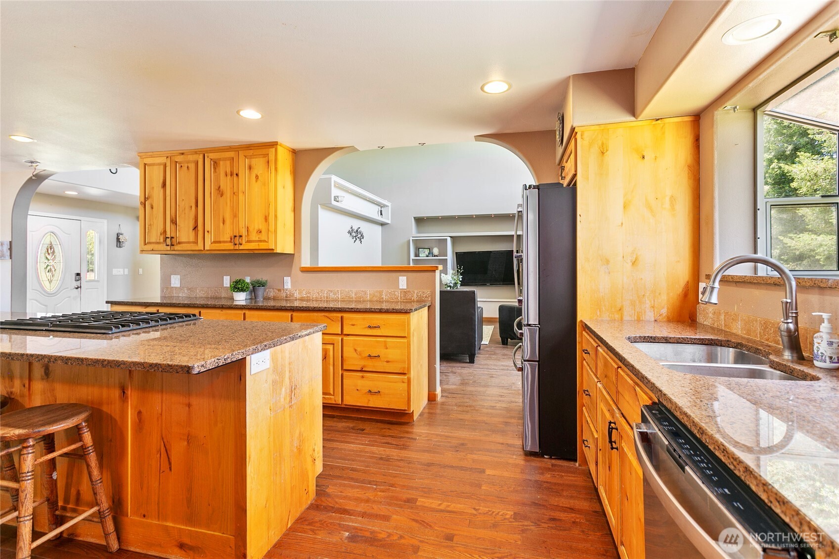 2176 Burk Road Blaine, WA 98230 - Photo 9 of 40 a kitchen with stainless steel appliances granite countertop a sink and a stove