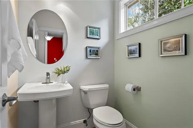 a bathroom with a toilet and a sink