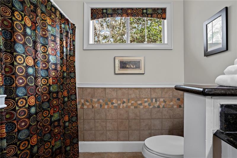 12 Rosalyn Road Georgetown, GA 39854 - Photo 31 of 102 a bathroom with a toilet and a shower curtain