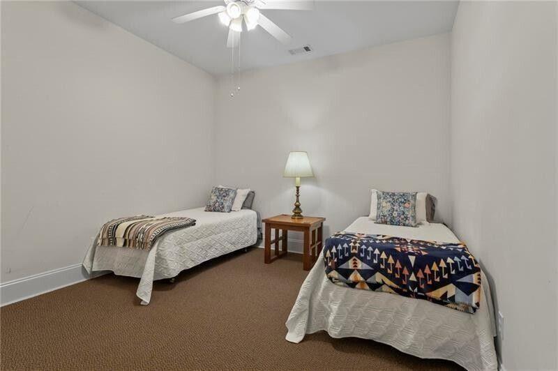 12 Rosalyn Road Georgetown, GA 39854 - Photo 49 of 96 a bedroom with a bed and a lamp