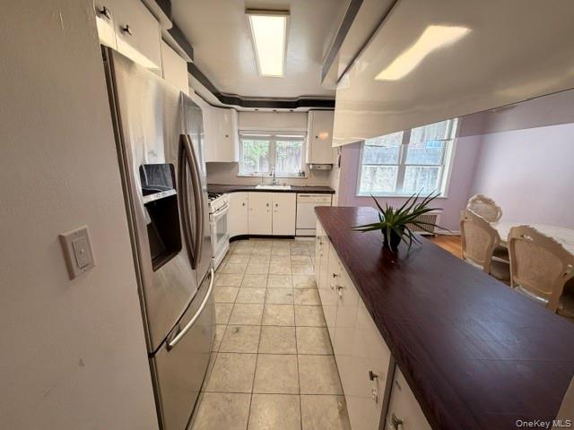150-06 78th Road Queens, NY 11367 - Photo 6 of 22 a living room with stainless steel appliances furniture and a large window