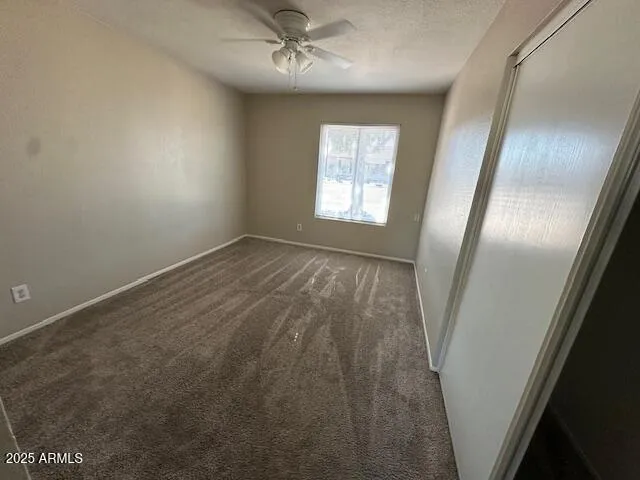 an empty room with windows closet and windows