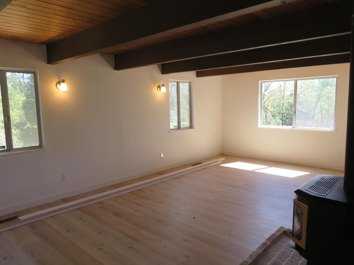 190 Bald Mountain Road West Point, CA 95255 - Photo 16 of 48 a view of empty room with wooden floor and fan