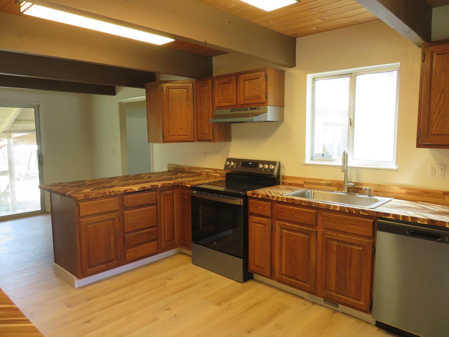 190 Bald Mountain Road West Point, CA 95255 - Photo 17 of 48 a kitchen with stainless steel appliances granite countertop a sink stove and cabinets